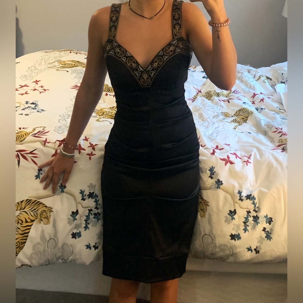 Stunning, body hugging, back satin dress with gold and silver detail. So unique!